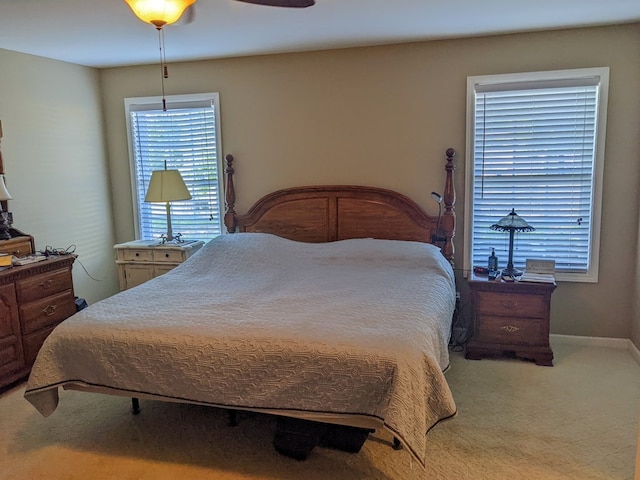 bedroom with ceiling fan and carpet floors