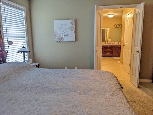 carpeted bedroom with connected bathroom