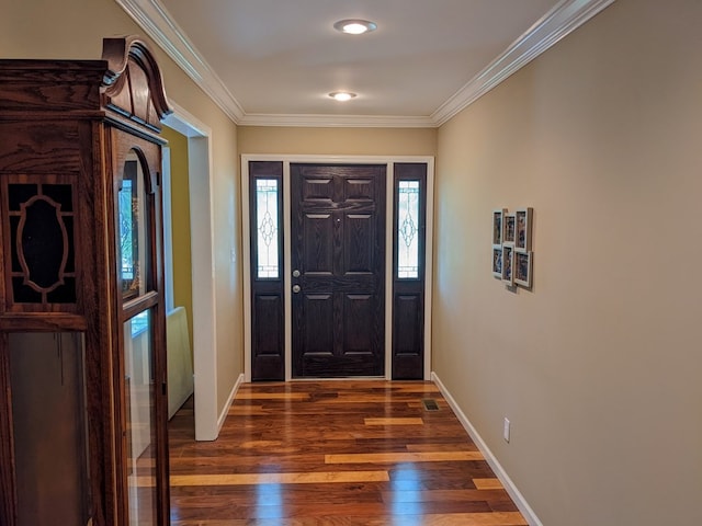 entryway featuring ornamental molding and dark hardwood / wood-style floors