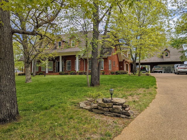 view of front of house featuring a front lawn and a carport