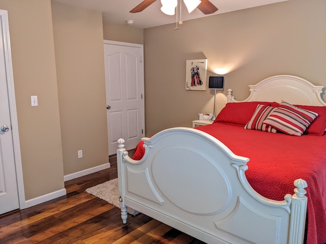 bedroom with ceiling fan and dark hardwood / wood-style flooring