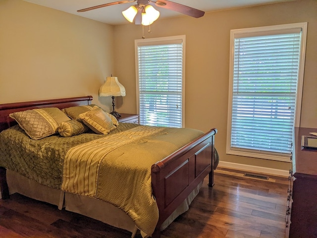 bedroom featuring dark hardwood / wood-style floors and ceiling fan