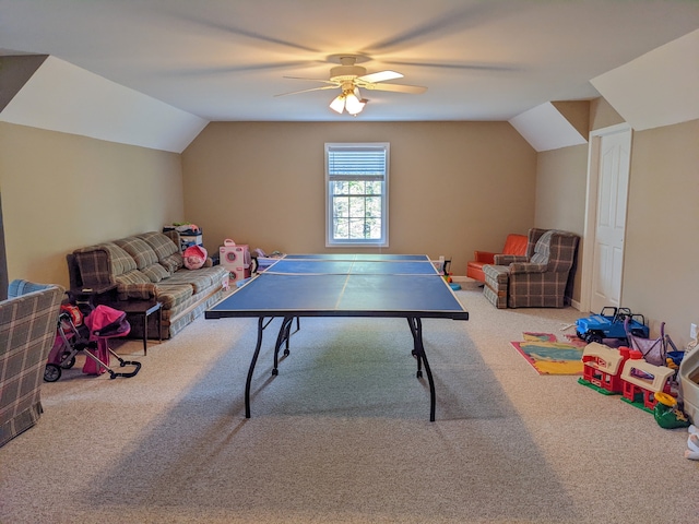 recreation room with vaulted ceiling, carpet, and ceiling fan