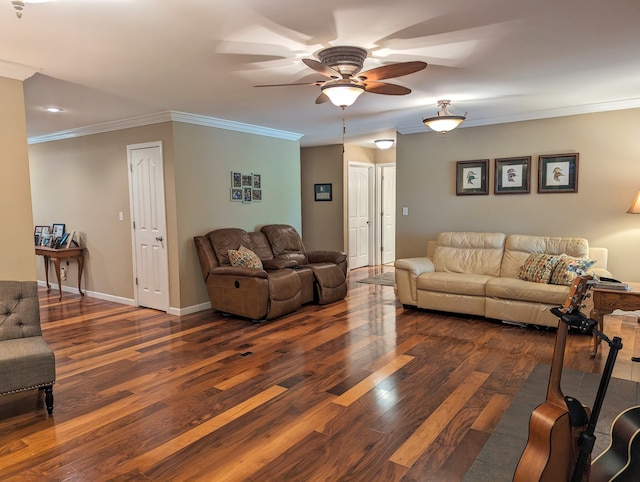 living room featuring ornamental molding, dark wood-type flooring, and ceiling fan