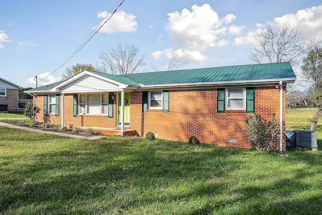 view of front of home featuring a front yard and central AC unit