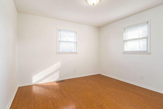 unfurnished room featuring wood-type flooring