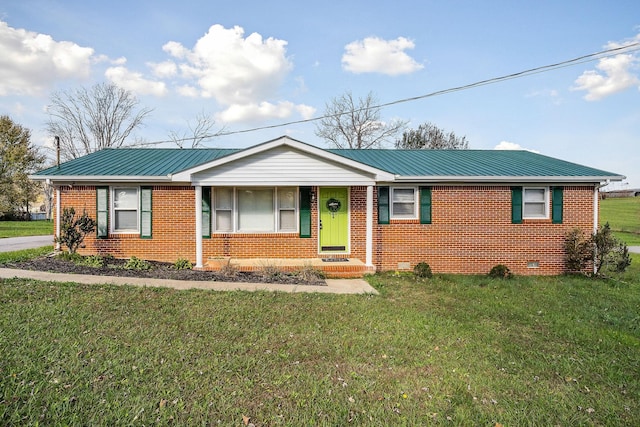 ranch-style home with a front lawn