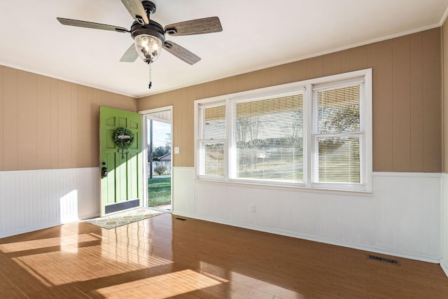 foyer featuring ceiling fan and hardwood / wood-style flooring