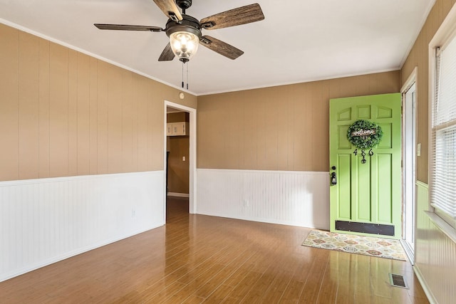 entryway featuring wood-type flooring and ceiling fan