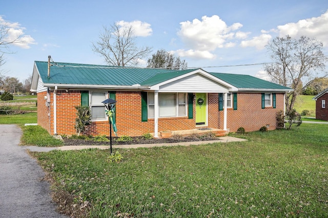 ranch-style home with a front lawn