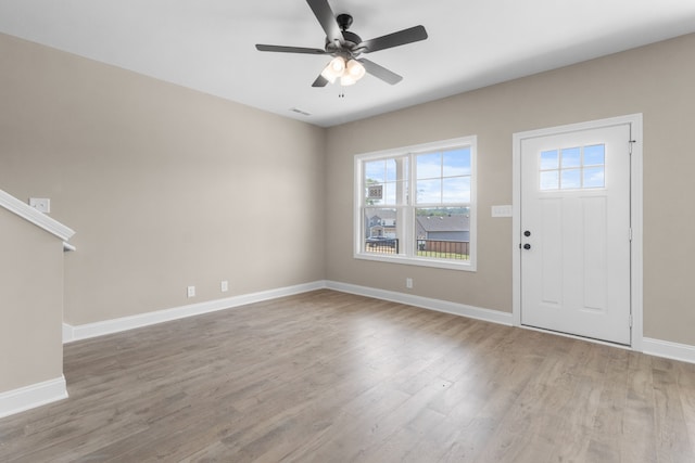 foyer with hardwood / wood-style flooring and ceiling fan