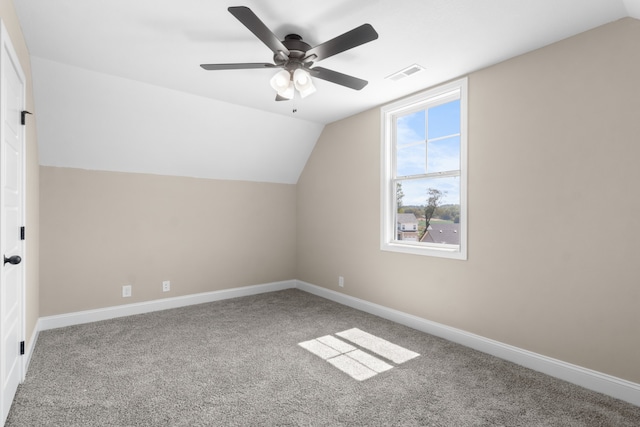 additional living space with vaulted ceiling, ceiling fan, and carpet floors