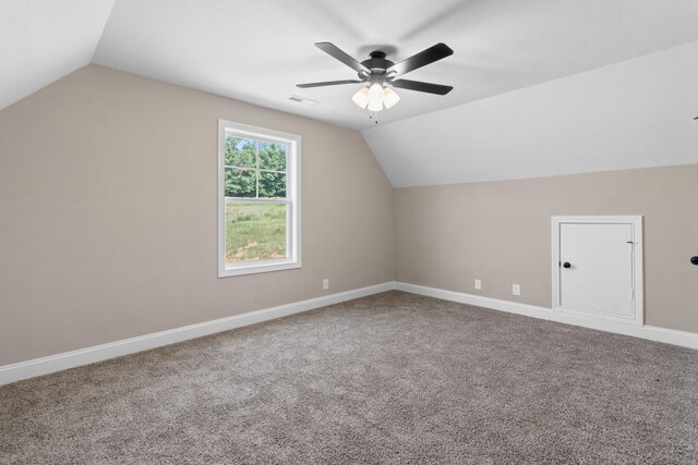 additional living space featuring lofted ceiling, ceiling fan, and carpet floors