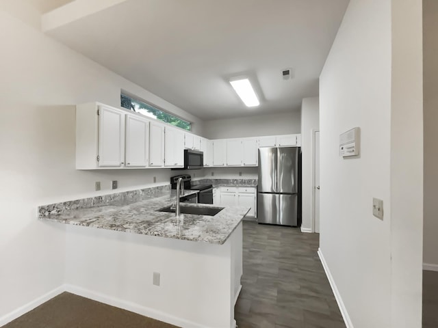 824 N Woodstone Ln, Nashville, TN 37211 - kitchen featuring freestanding refrigerator, black microwave, range with electric cooktop, a sink, and baseboards