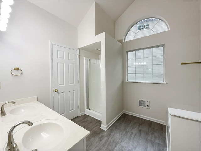 824 N Woodstone Ln, Nashville, TN 37211 - bathroom with a shower stall, double vanity, baseboards, and a towering ceiling