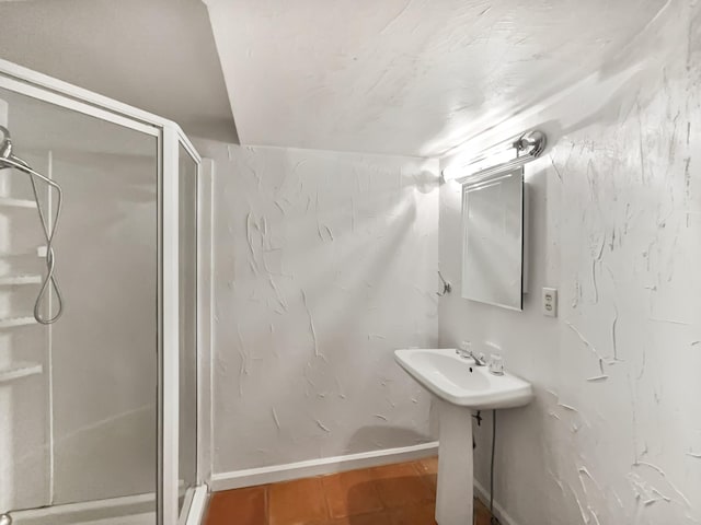 824 N Woodstone Ln, Nashville, TN 37211 - bathroom with a stall shower, a sink, and baseboards