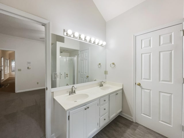 824 N Woodstone Ln, Nashville, TN 37211 - bathroom with vaulted ceiling, baseboards, and double vanity