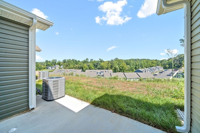 view of yard with central AC unit