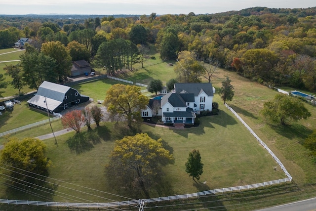 birds eye view of property with a rural view