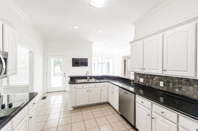 kitchen with dishwasher, white cabinetry, sink, and kitchen peninsula