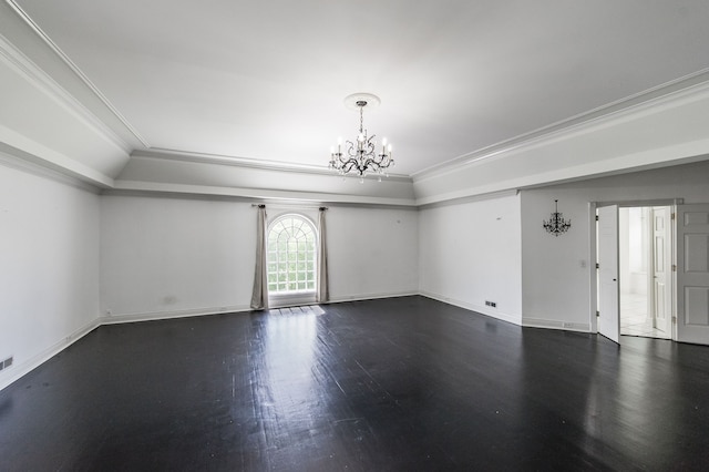 empty room featuring ornamental molding, dark hardwood / wood-style floors, and an inviting chandelier