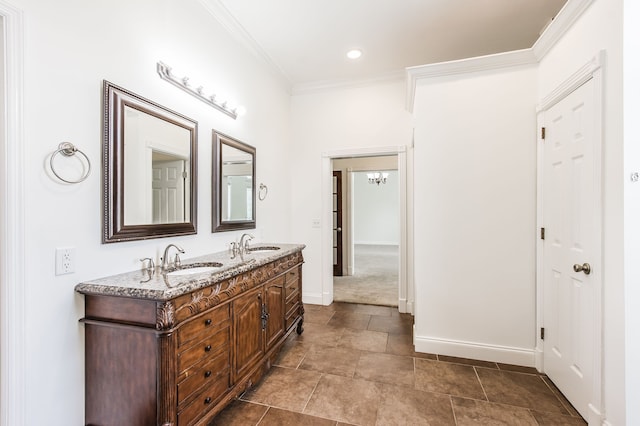 bathroom with ornamental molding and vanity