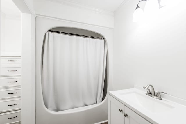 bathroom featuring vanity and ornamental molding