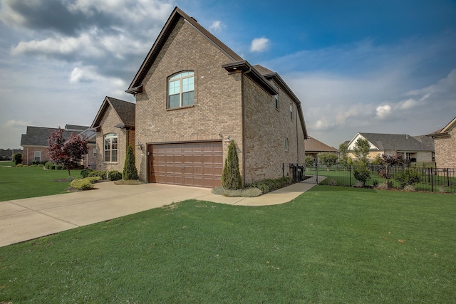 view of front of house with a garage and a front yard