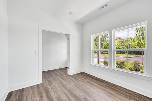 spare room featuring dark hardwood / wood-style flooring