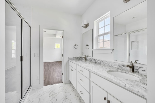 bathroom featuring a shower with door, tile floors, and double sink vanity