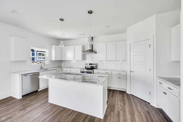 kitchen with stainless steel appliances, dark wood-type flooring, and white cabinetry