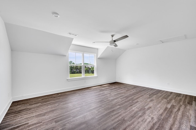 additional living space with lofted ceiling, ceiling fan, and dark hardwood / wood-style flooring