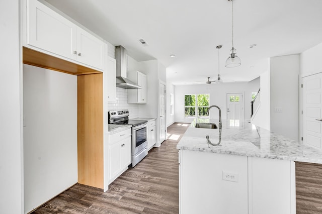 kitchen featuring wall chimney range hood, dark wood-type flooring, electric range, and sink