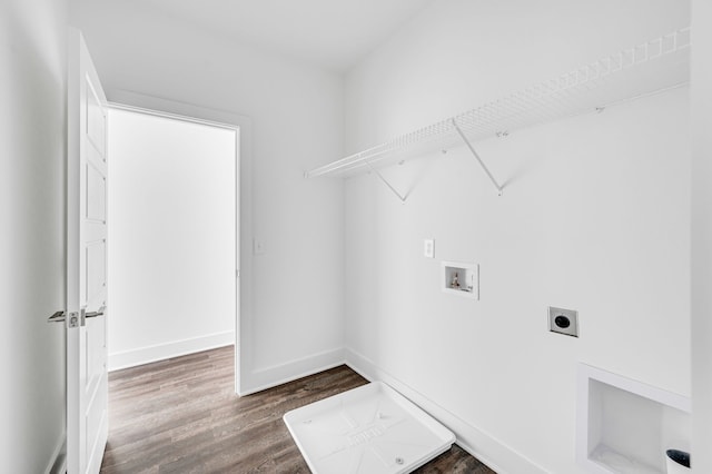 clothes washing area with hookup for a washing machine, hardwood / wood-style flooring, and electric dryer hookup