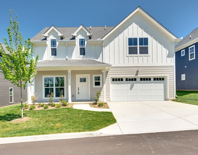 view of front facade with a garage and a front lawn