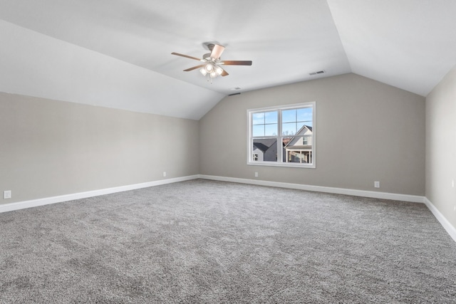 bonus room featuring ceiling fan, vaulted ceiling, and carpet