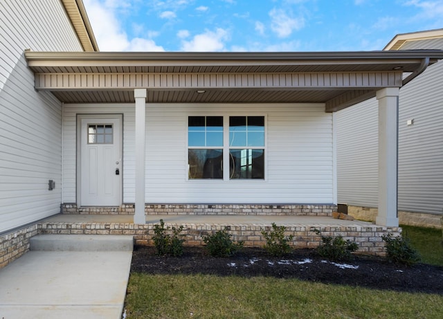 doorway to property featuring a porch