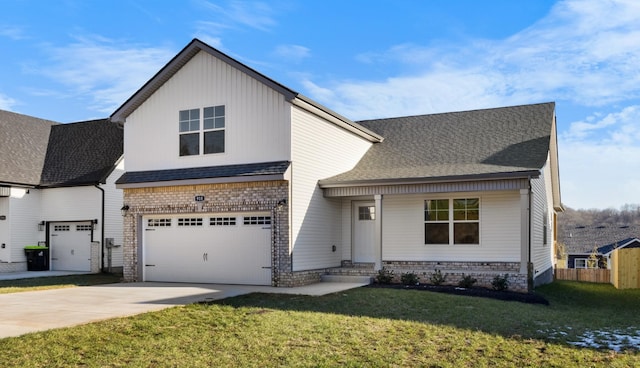 view of front facade with brick siding, a shingled roof, a front lawn, concrete driveway, and an attached garage