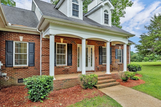 view of front facade with a porch and a front yard