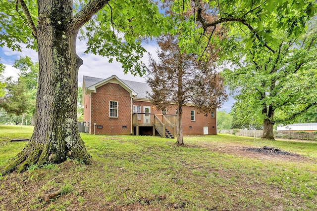 view of yard featuring a wooden deck