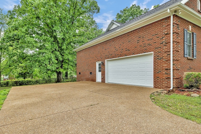 view of side of home with a garage