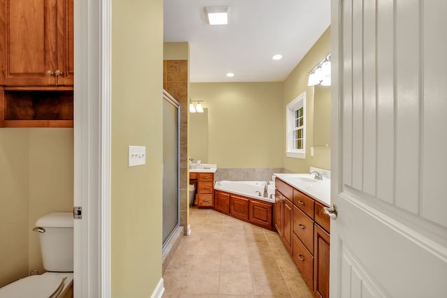 full bathroom featuring independent shower and bath, toilet, tile floors, and vanity