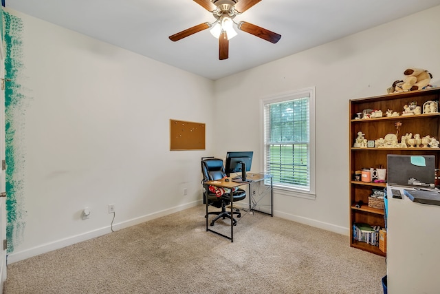 office space featuring light colored carpet and ceiling fan