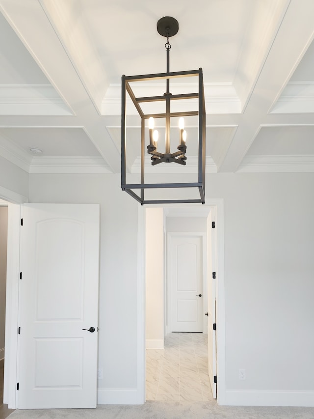 interior space with an inviting chandelier, light tile floors, and coffered ceiling