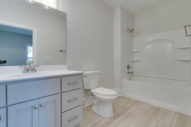 full bathroom featuring shower / bathtub combination, toilet, and large vanity