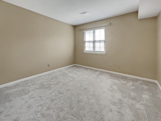 unfurnished room featuring carpet