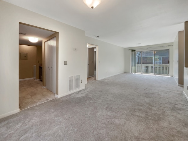 unfurnished room with light colored carpet