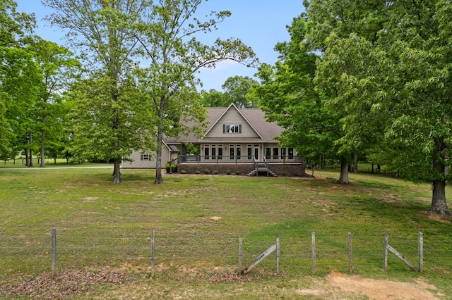 view of front of house with a front yard and a porch