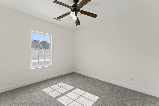 empty room featuring carpet and ceiling fan