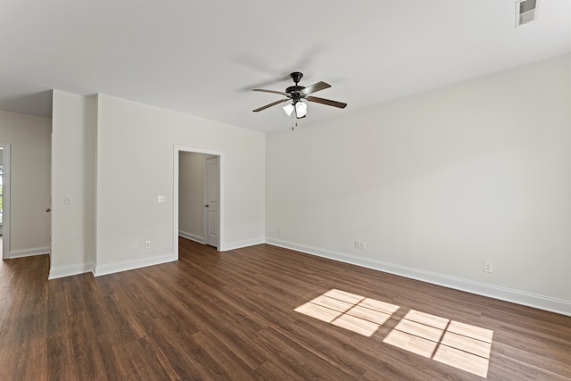 empty room featuring dark hardwood / wood-style floors and ceiling fan